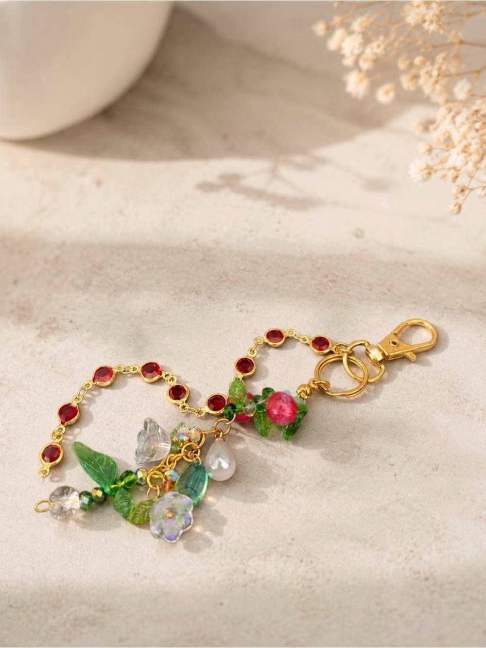 Gold-Tone Floral Charm Keychain with Red and Green Accents